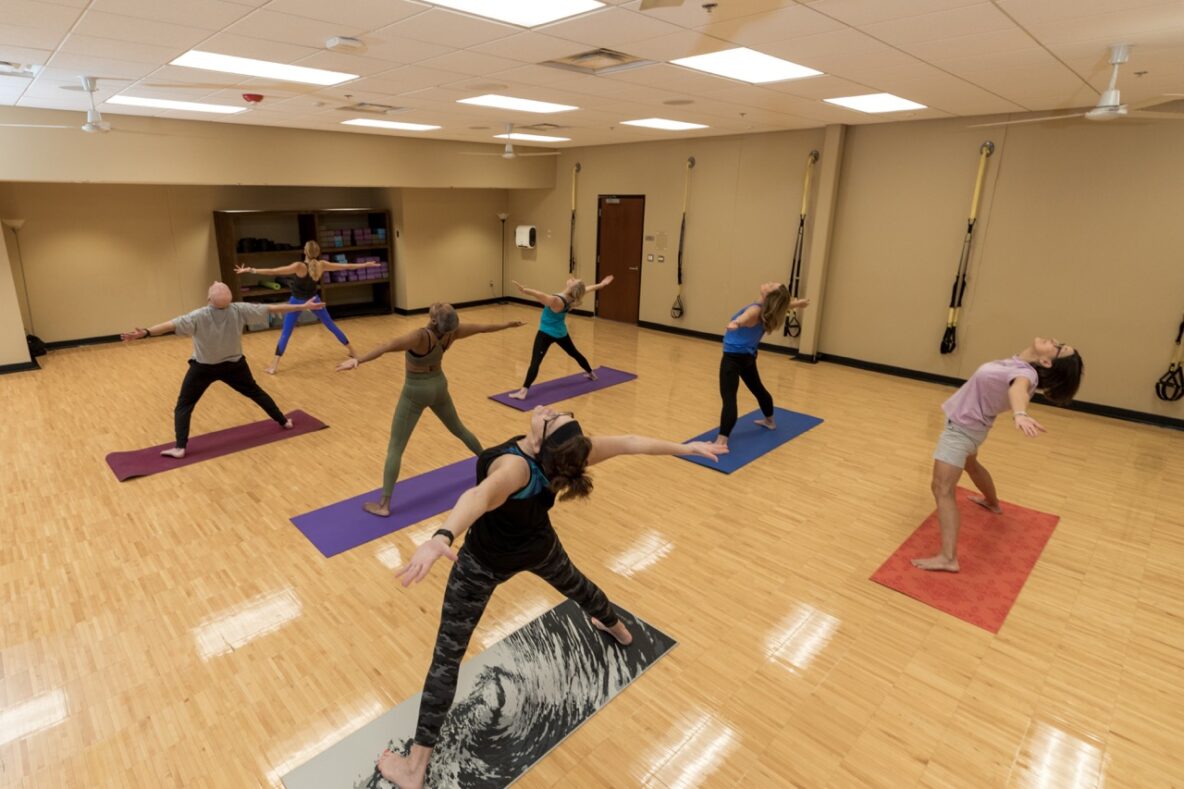 group of 7 in a group yoga class
